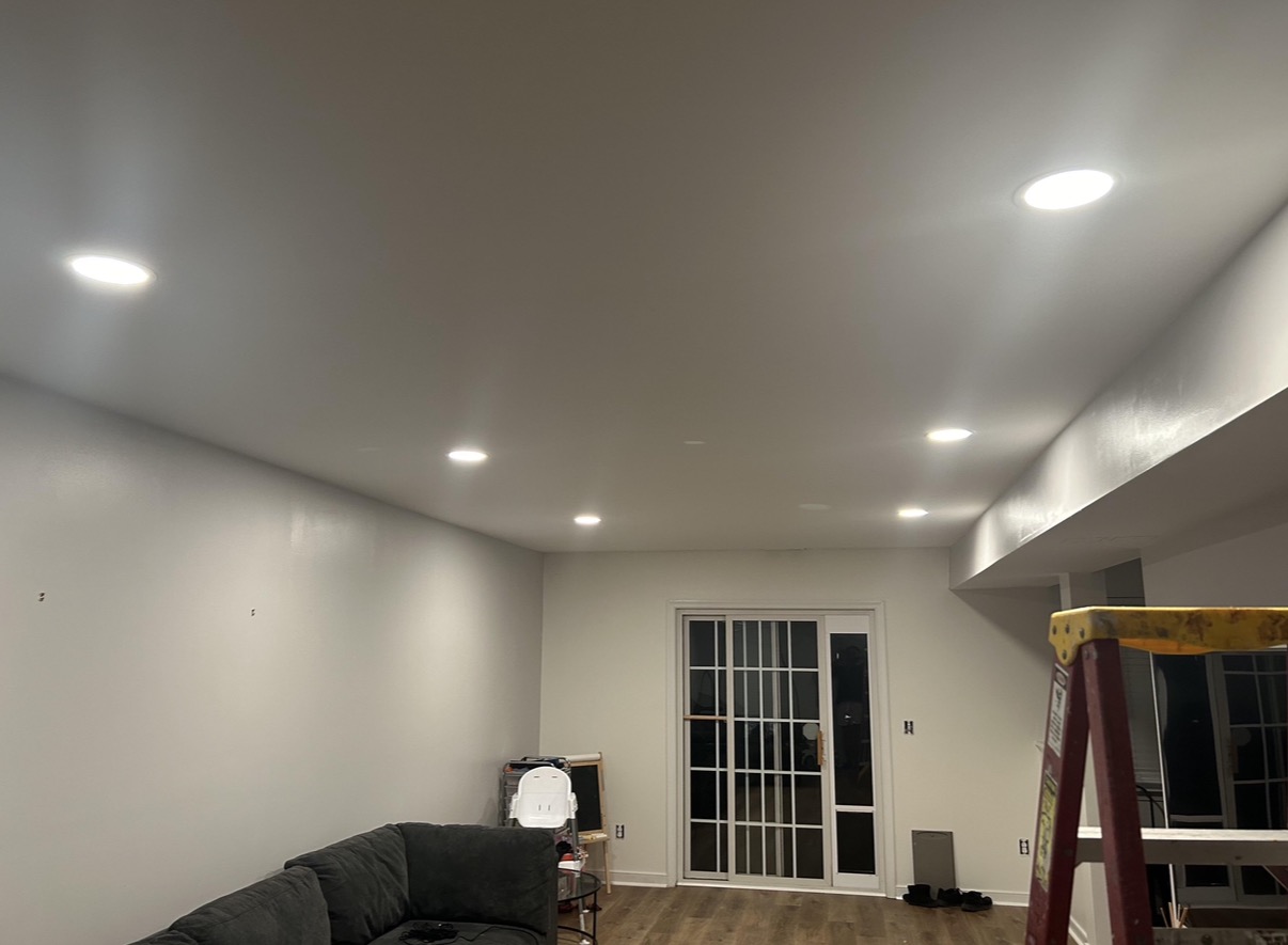 Recessed pot lights installed in a living room ceiling in Aurora