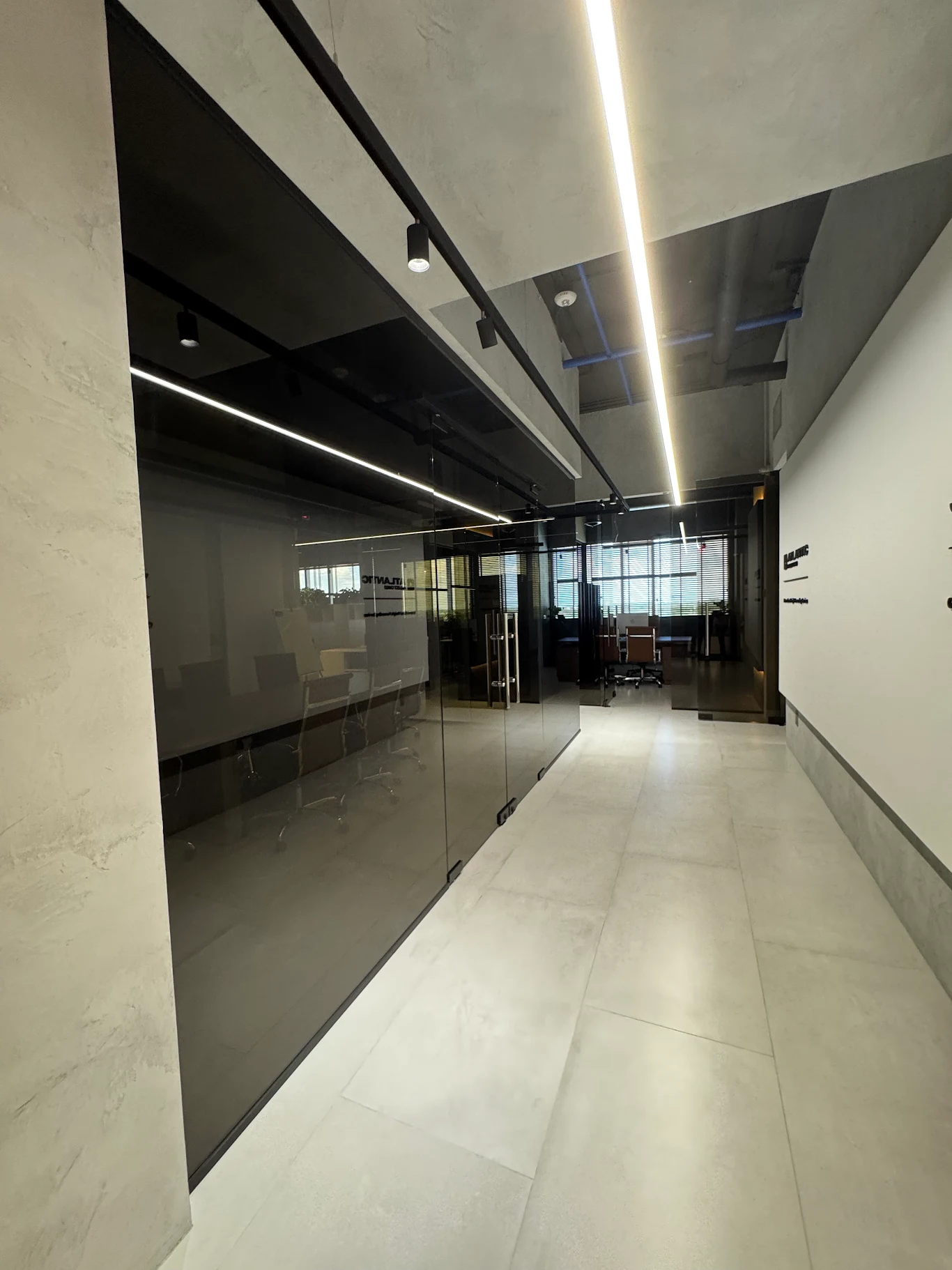 Modern office linear lighting installation by a commercial electrician